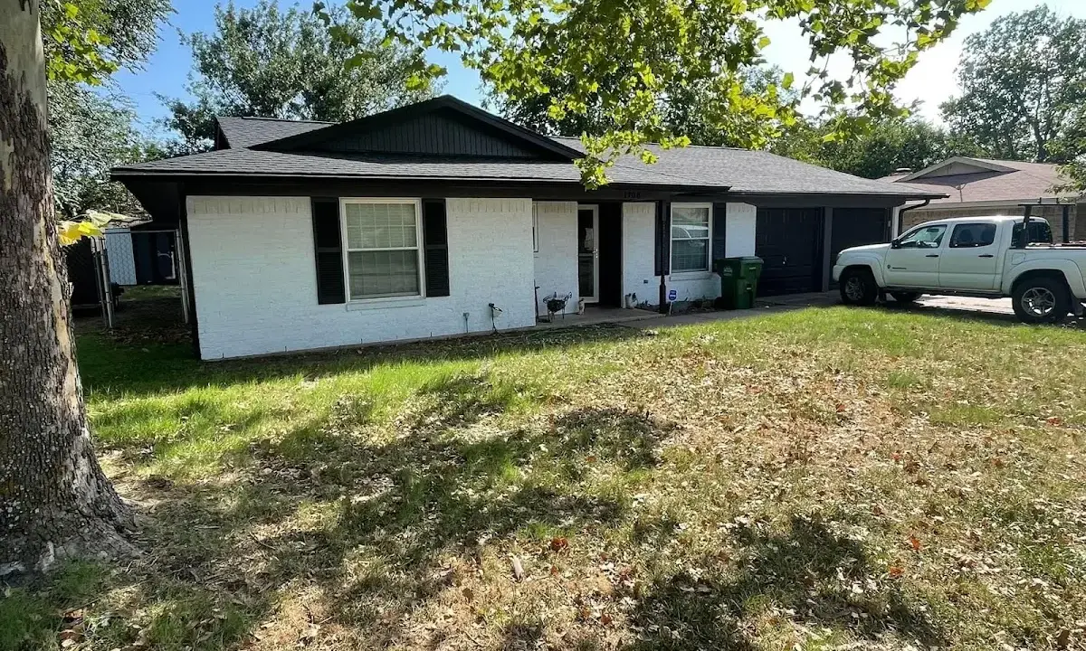 Professional roofing crew working on a residential roof in Beaumont
